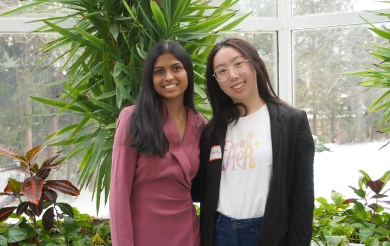 CapitalHER team members Thivya and Kathy