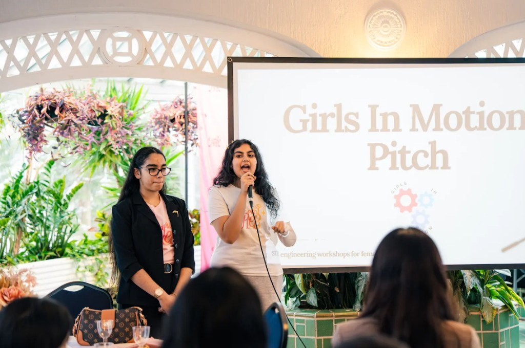 Participant pitching at CapitalHER